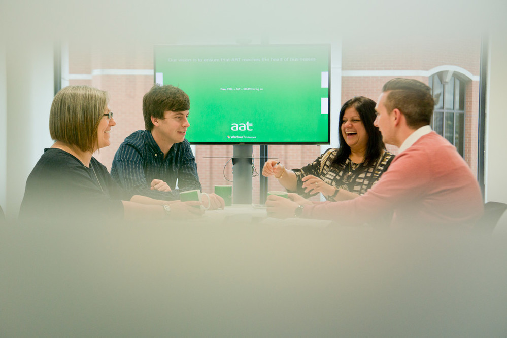 AAT staff in a meeting room